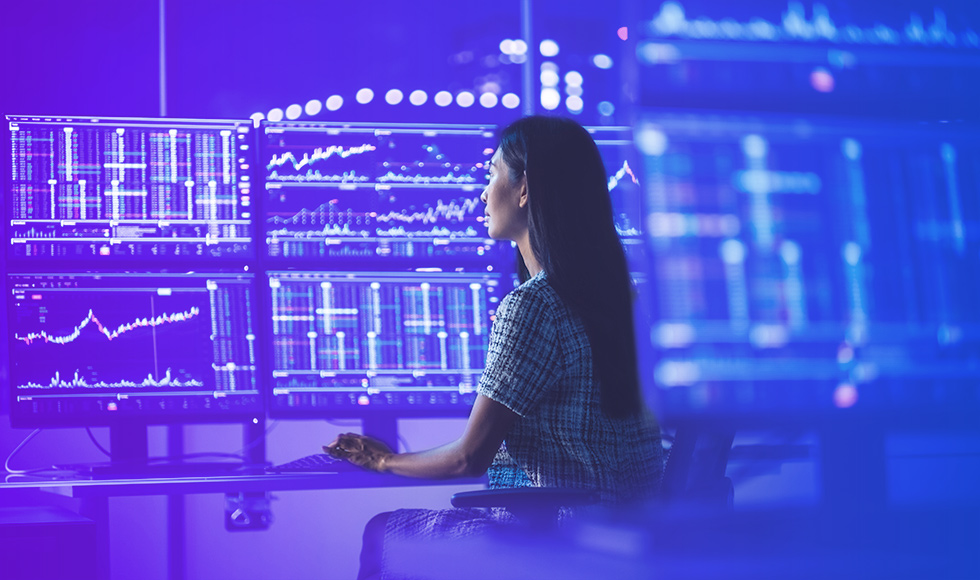 woman sitting in front of a workstation
